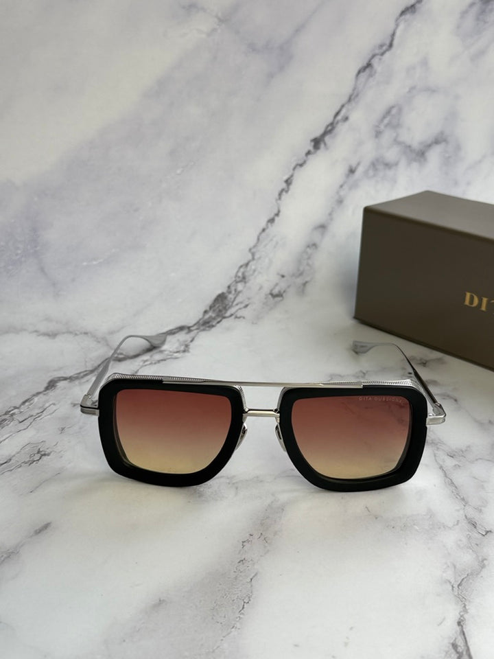 Aviator sunglasses with matte black frame and rose-tinted square lenses, front view