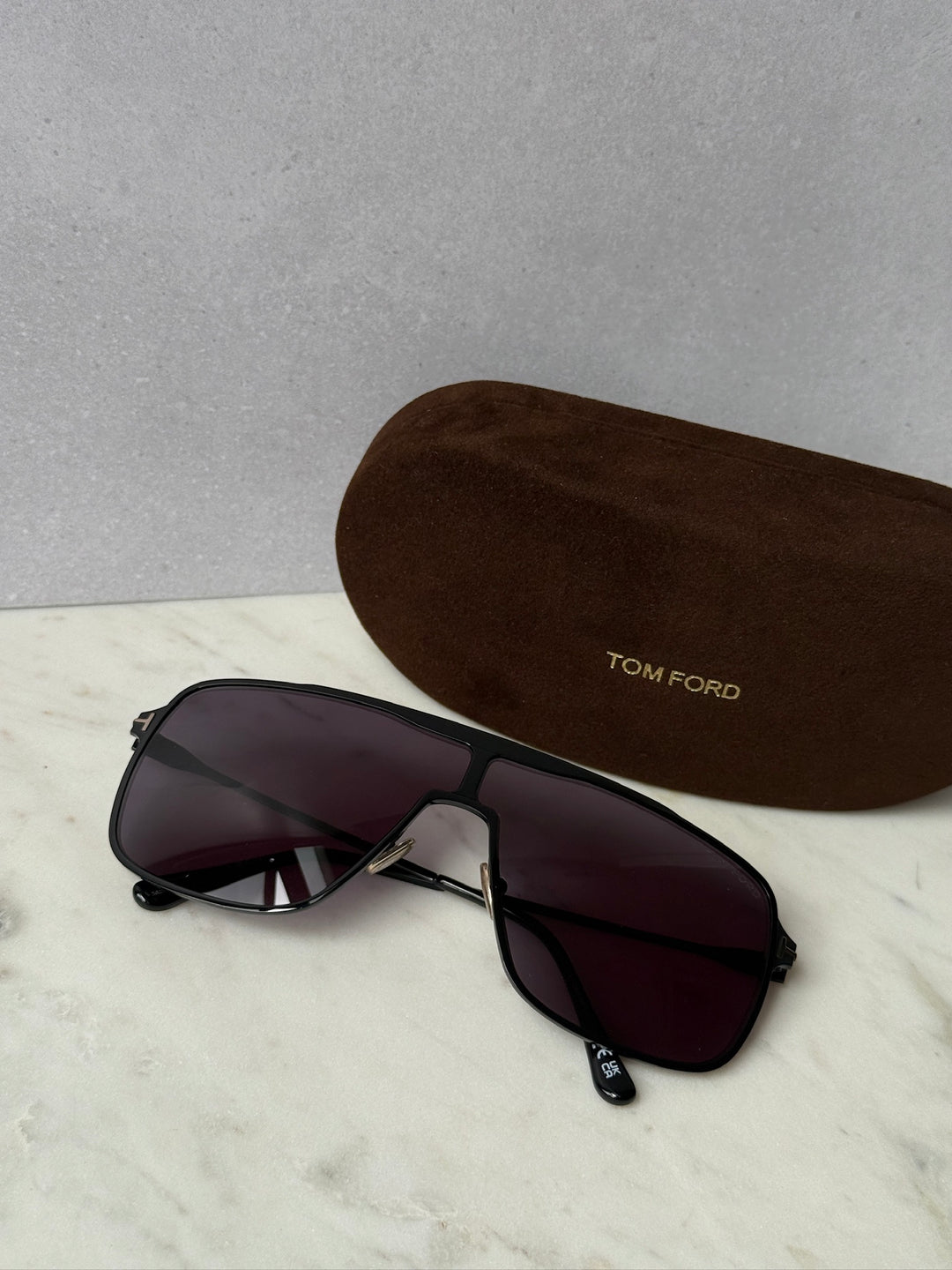 Zappa black aviator sunglasses with purple lenses, brown case labeled TOM FORD