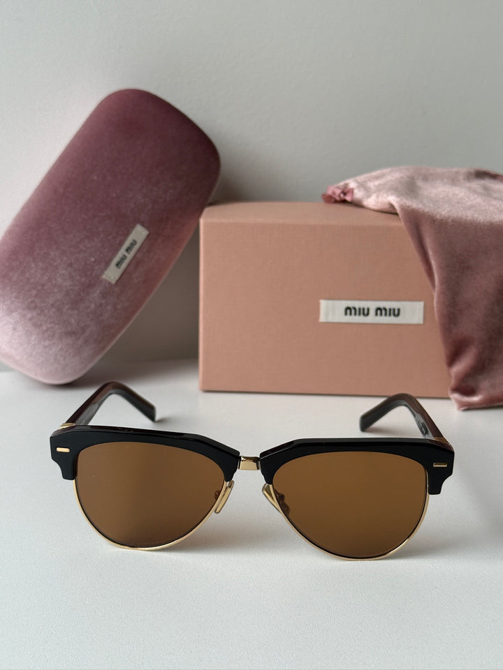 Miu Miu black cat-eye sunglasses with brown tinted lenses with box and dust bag