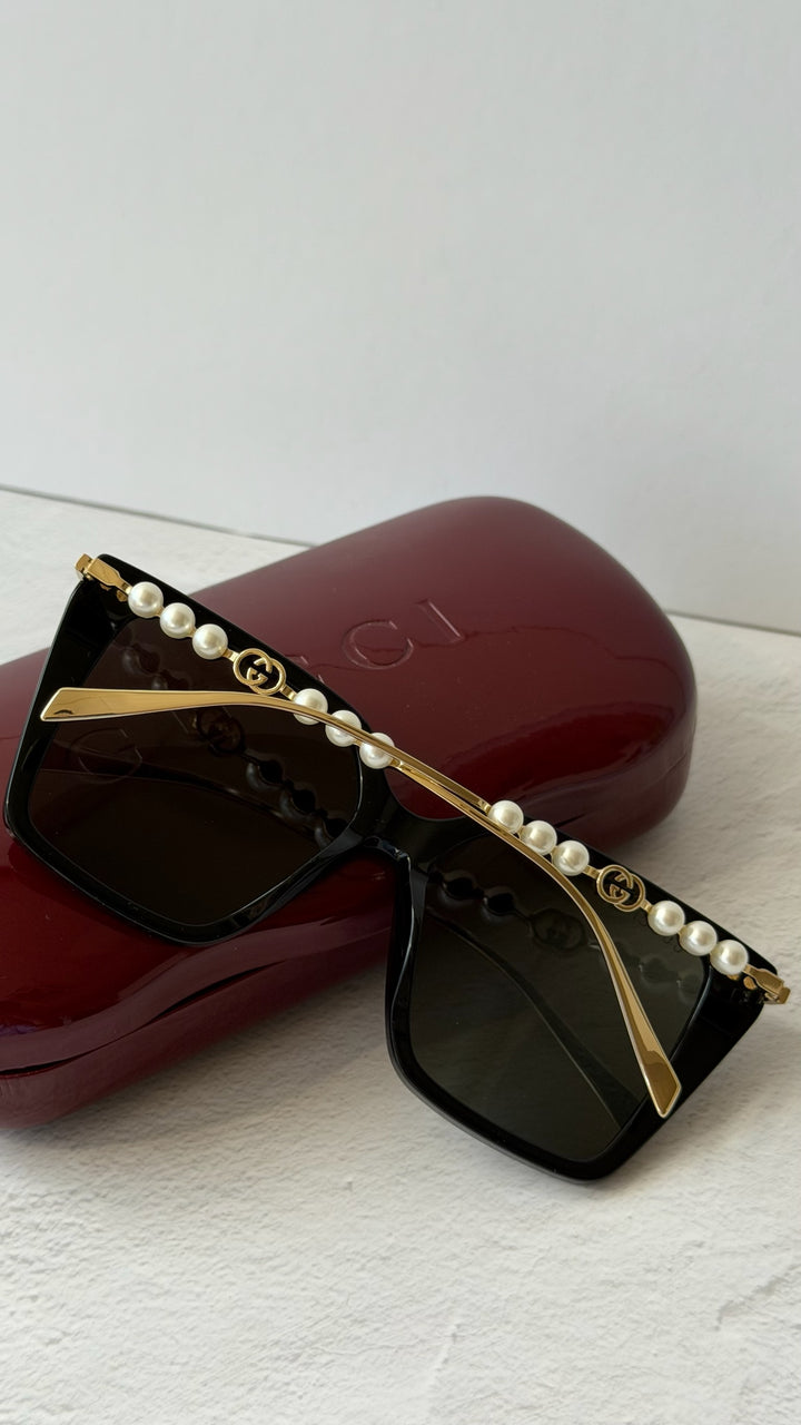 Gucci GG1257S Gafas de sol redondeadas con lentes marrones y rojos