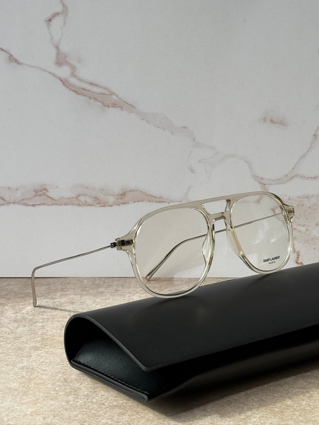 Clear round aviator eyeglasses with gold-tone metal and dark-tint lenses
