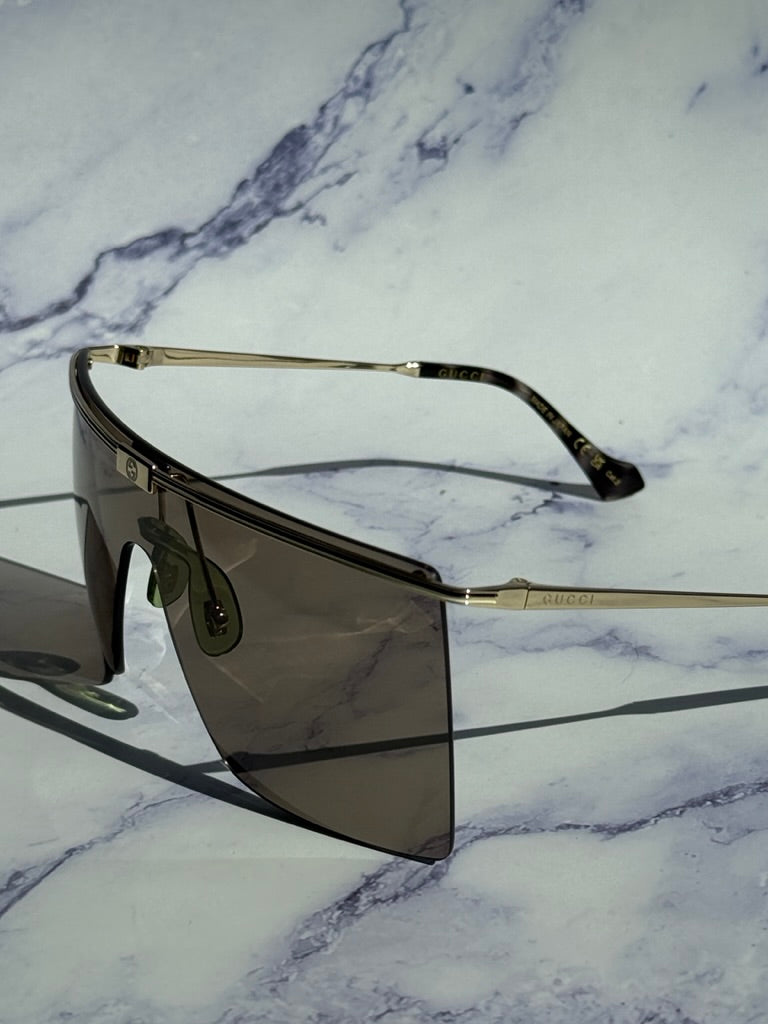 Gucci GG1096S Gafas de sol sin montura con protección marrón