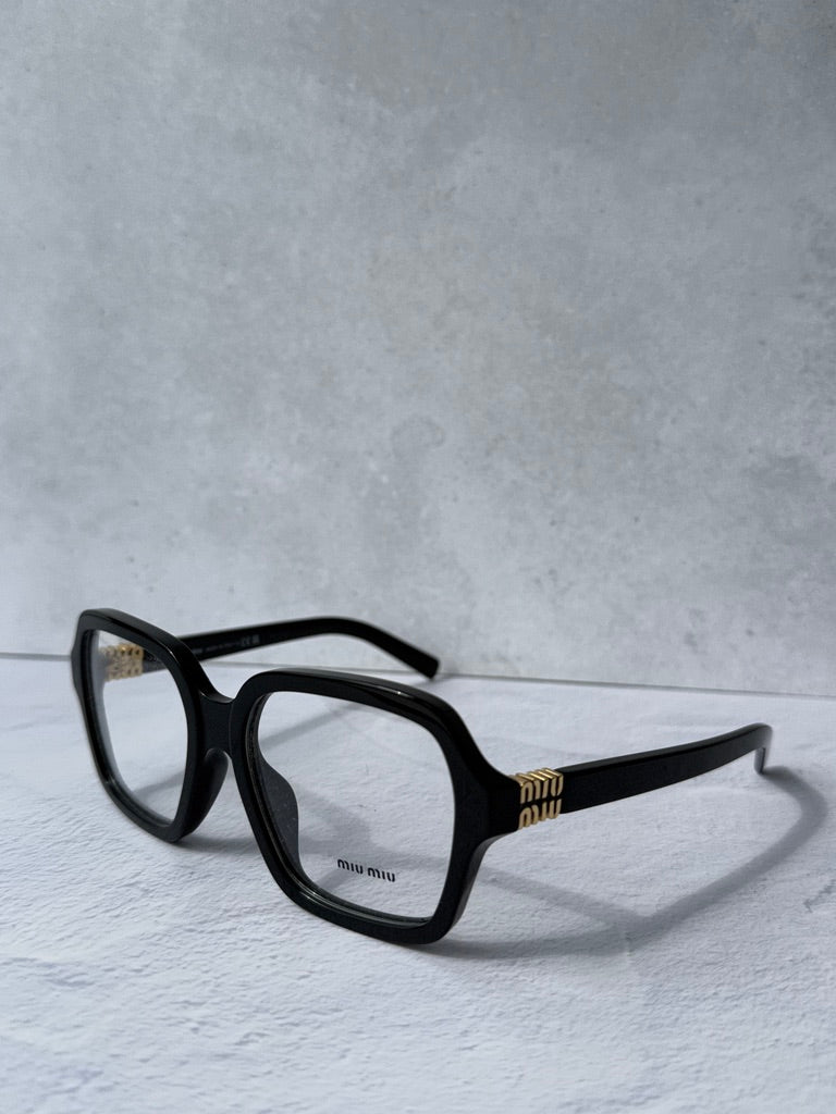 Black square eyeglass frames, side profile with gold temple detailing