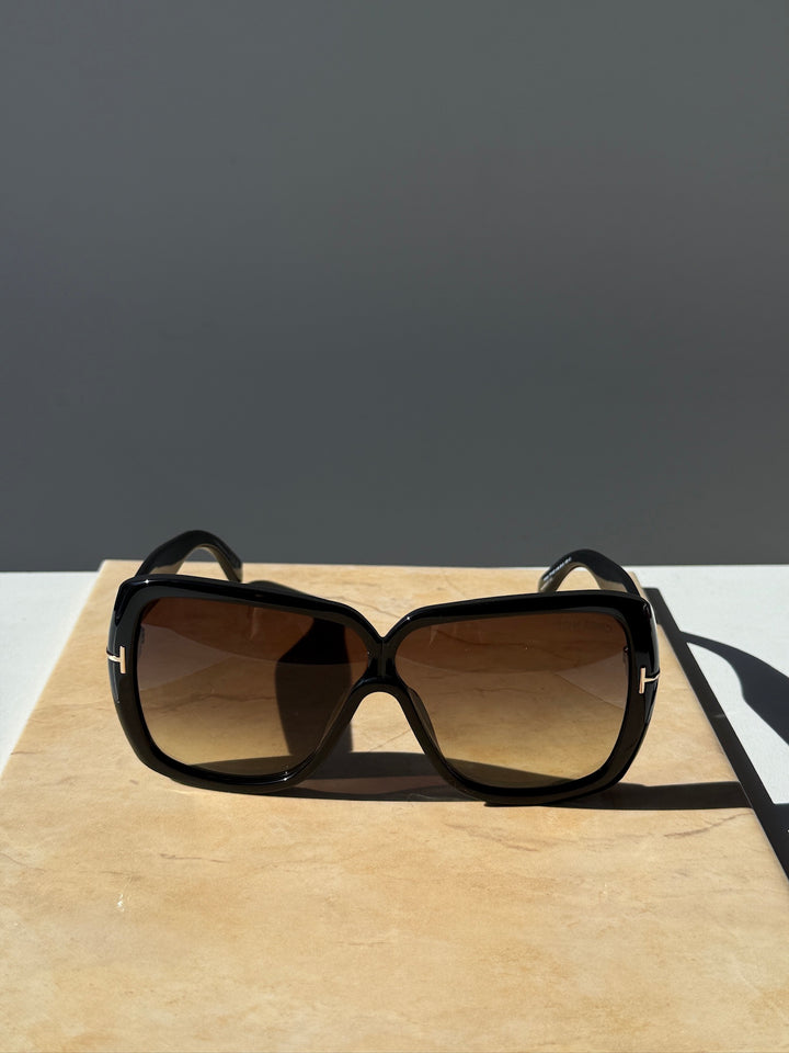 Black square sunglasses with brown-tinted lenses and curved arms