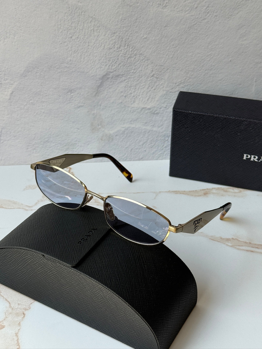 Prada PR D51S Metal Oval Sunglasses in Gold Blue