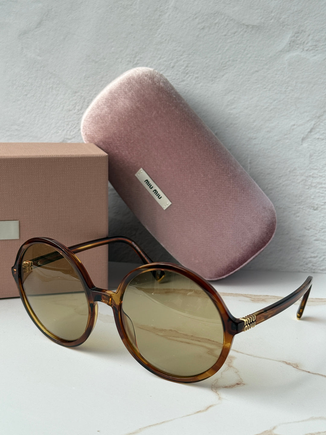 Miu Miu oversized round sunglasses, brown tortoiseshell frames, gold-tone arms
