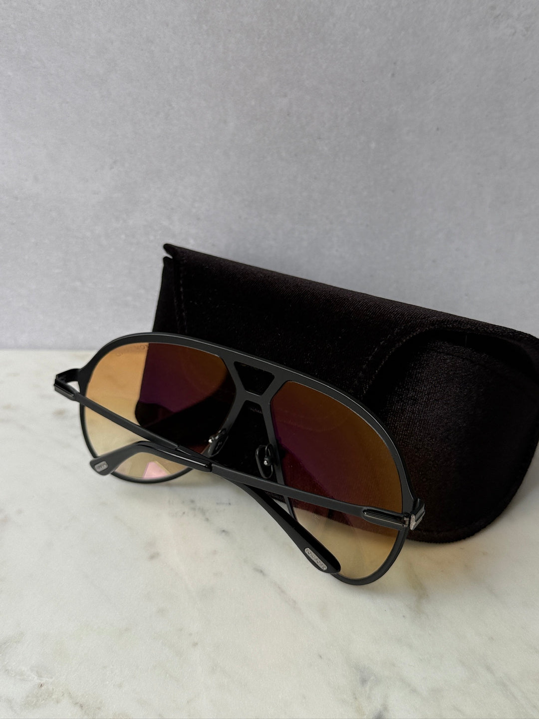 Oversized black aviator sunglasses with tinted lenses, arched bridge and metal arms