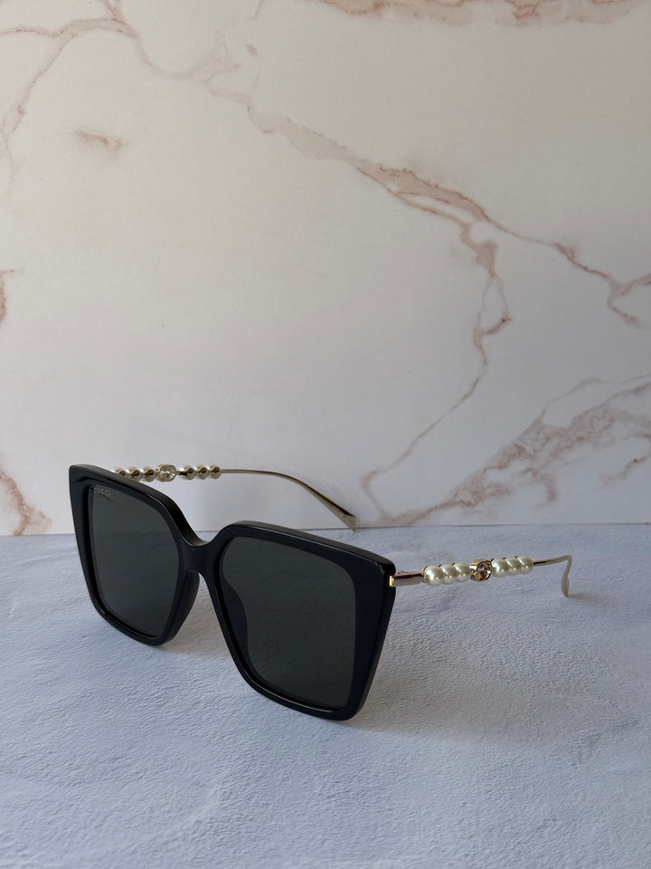 Gucci GG1257S Gafas de sol redondeadas con lentes marrones y rojos