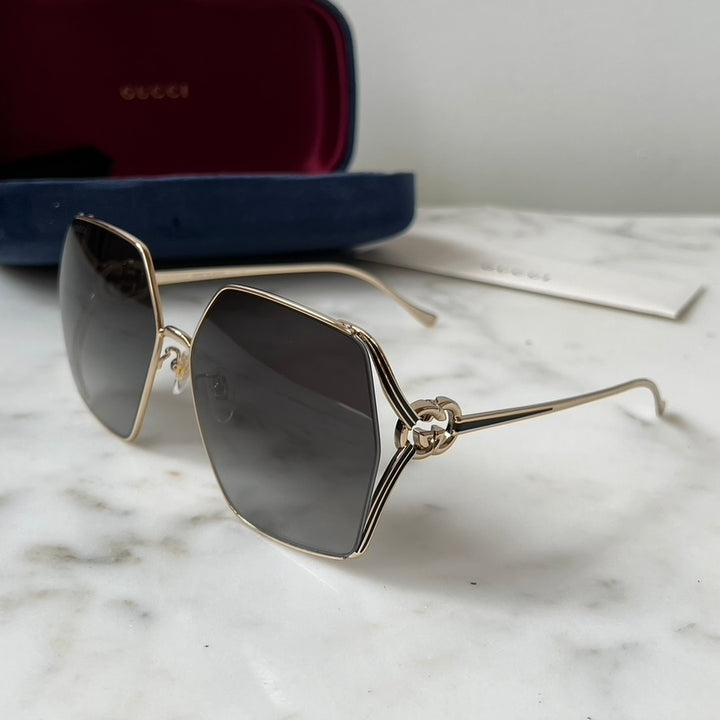 Gafas de sol de metal Gucci GG1322SA con lentes grises