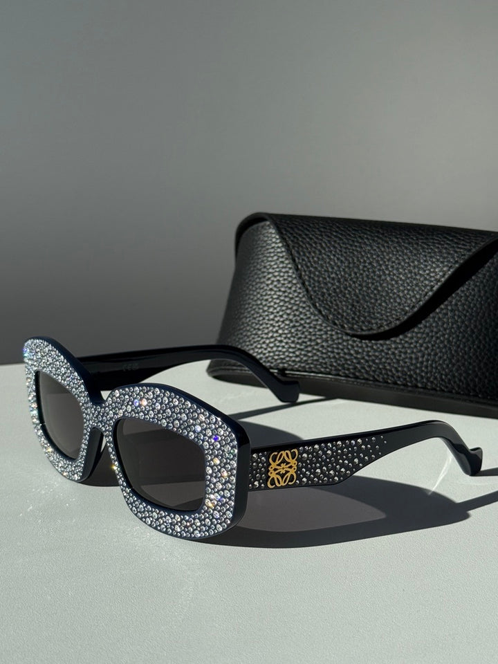 Loewe anagram sunglasses with rhinestone front, black lenses, blue logo on temple