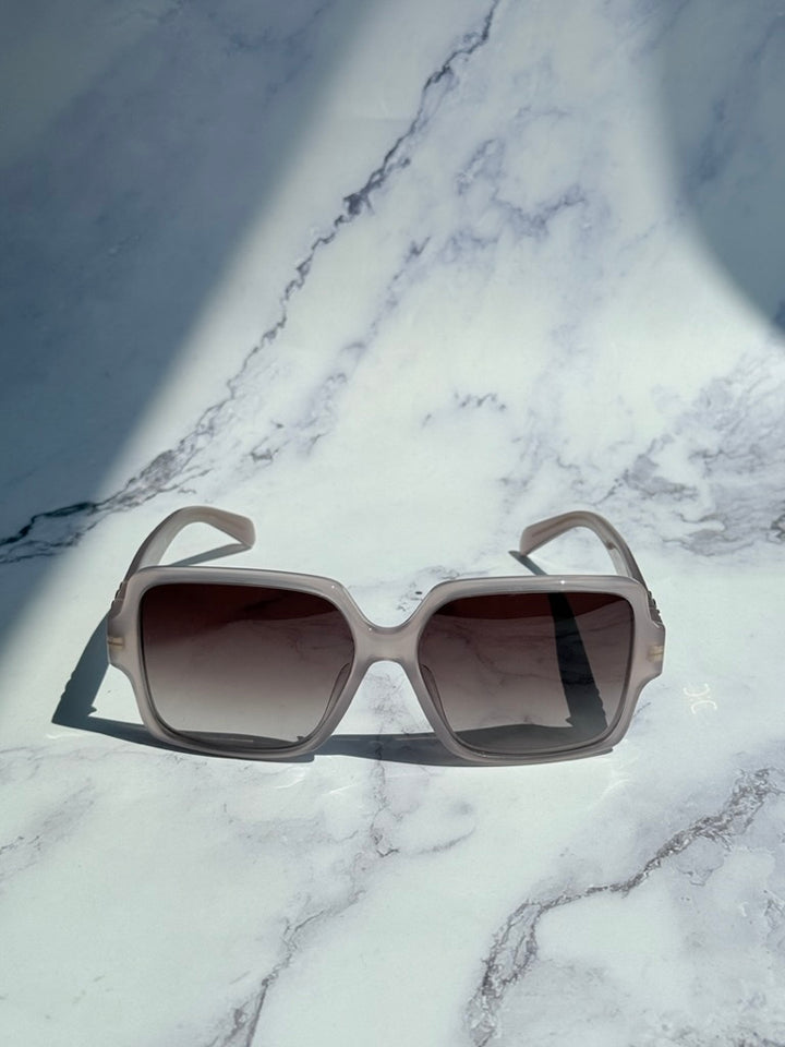 Taupe square sunglasses with dark tinted lenses, front view, wide frame