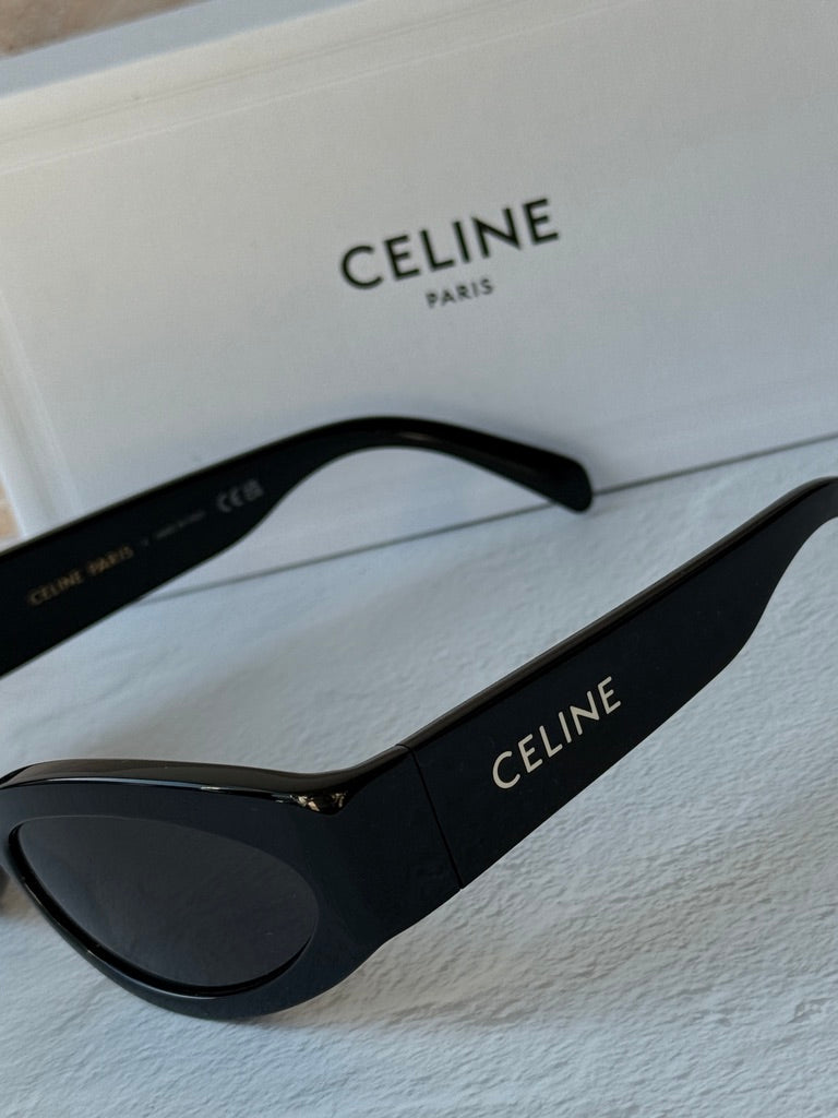 Celine black cat-eye sunglasses close-up, dark lens and temple logo