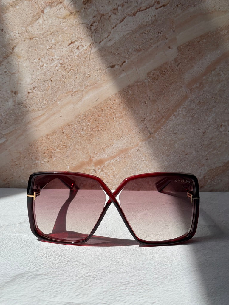 Burgundy square sunglasses front view with tinted gradient lenses and logo on arm