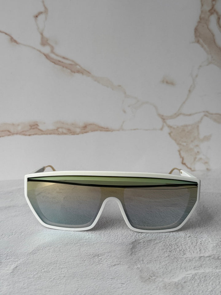 White DiorClub M7U visor sunglasses with a wide gray-green shield lens