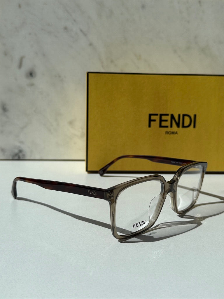 Unisex Fendi transparent brown eyeglass frames with clear lenses, side angle