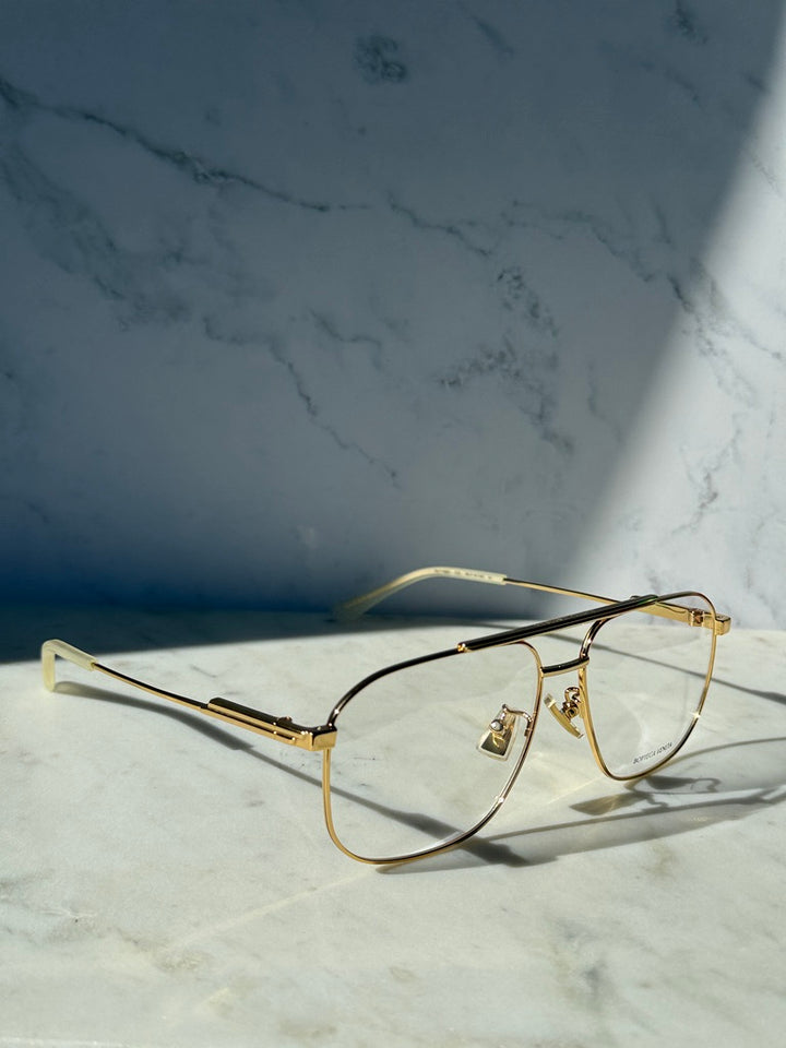 Gold pilot eyeglass frames with clear lenses and slim bridge design
