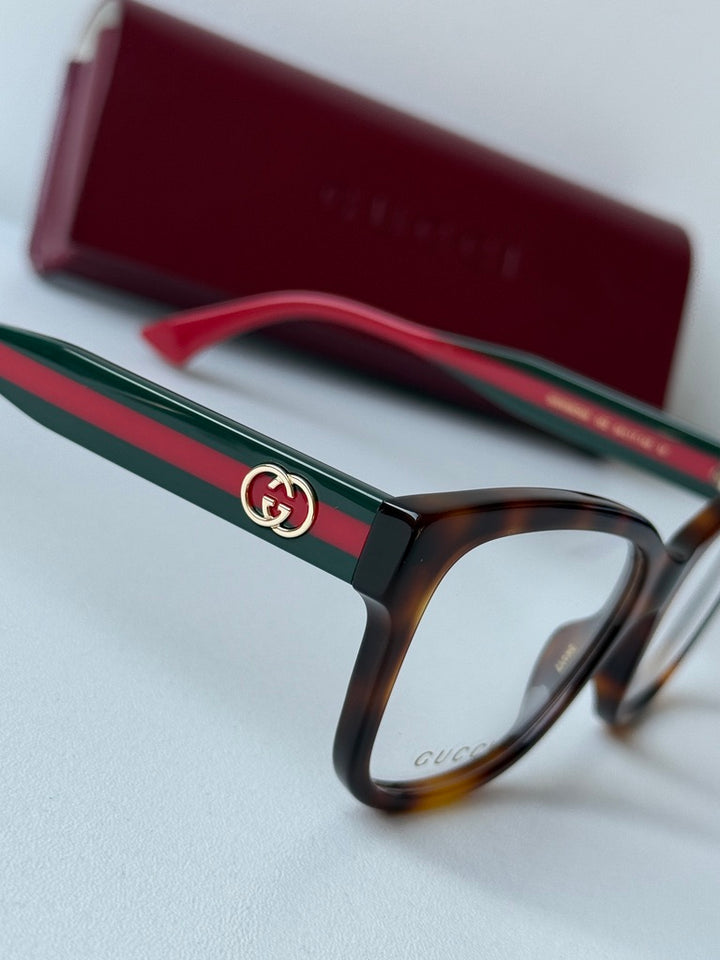 Monturas de anteojos Gucci GG0038ON con patas a rayas negras