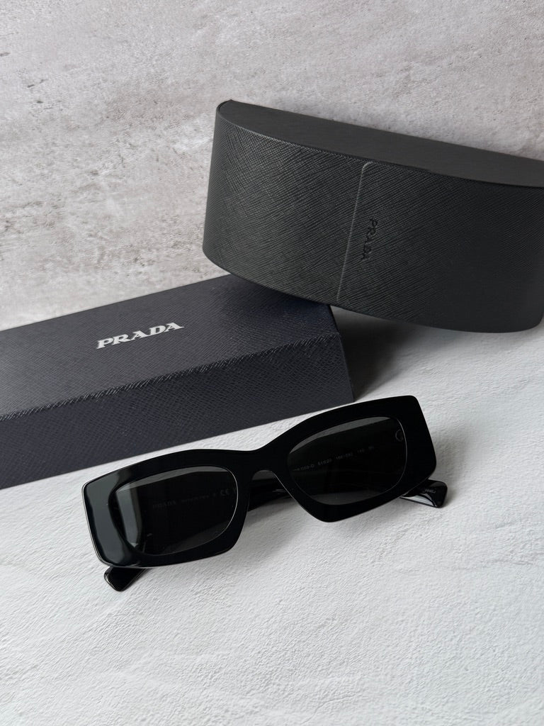 Black PRADA sunglasses with dark lenses, black case and logo pouch