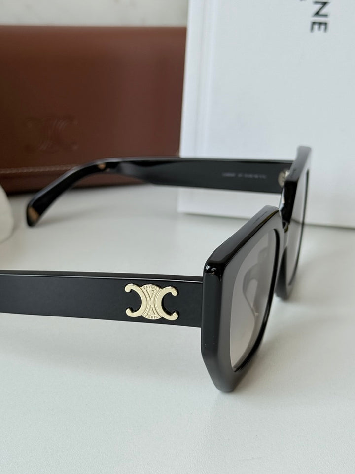 Celine black squared cat-eye sunglasses with gold Triomphe logo close-up