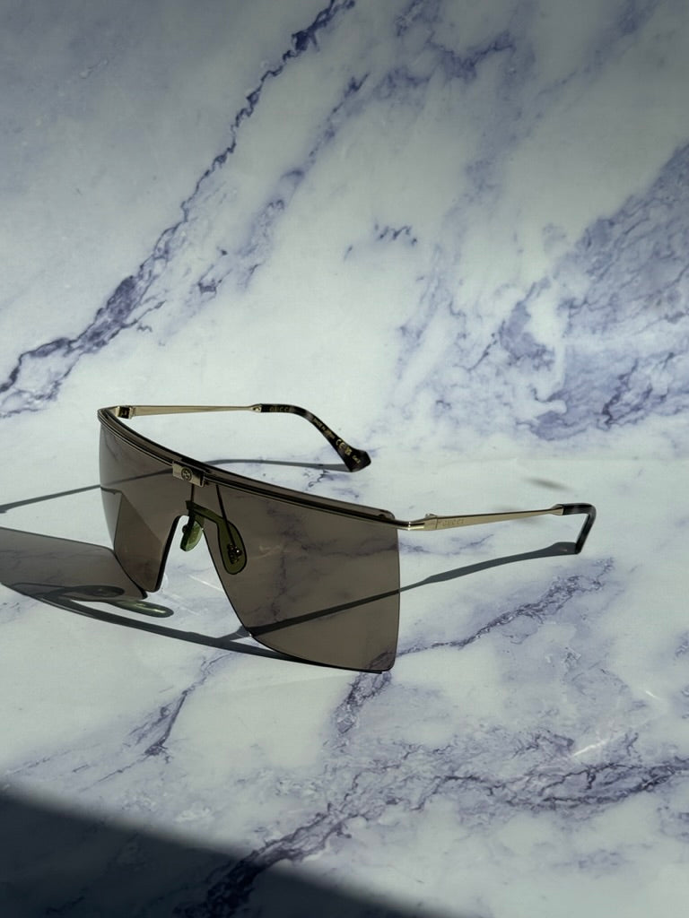 Gucci GG1096S Gafas de sol sin montura con protección marrón