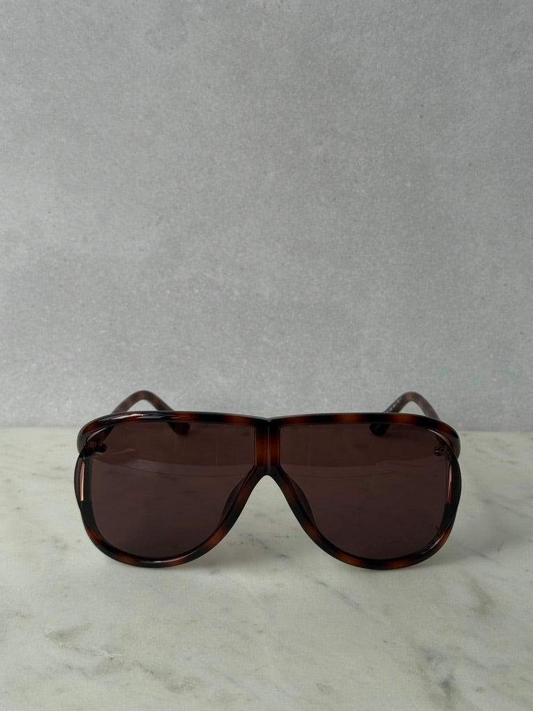 Aviator sunglasses with havana brown frames and dark tinted rectangular lenses