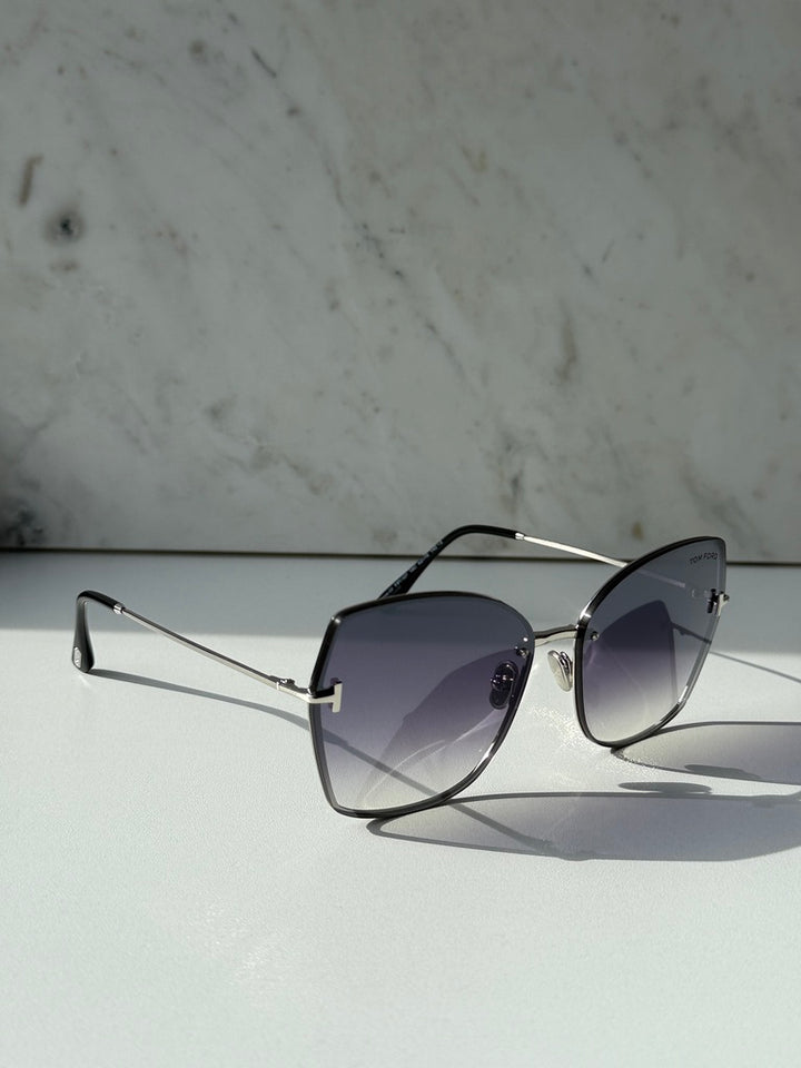 Silver grey shield sunglasses with dark gradient lenses, angled side view