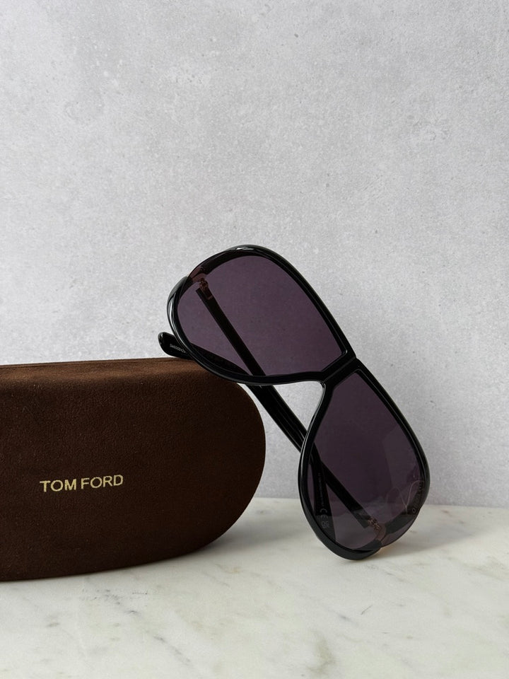 Black aviator sunglasses with dark purple lenses and protective case