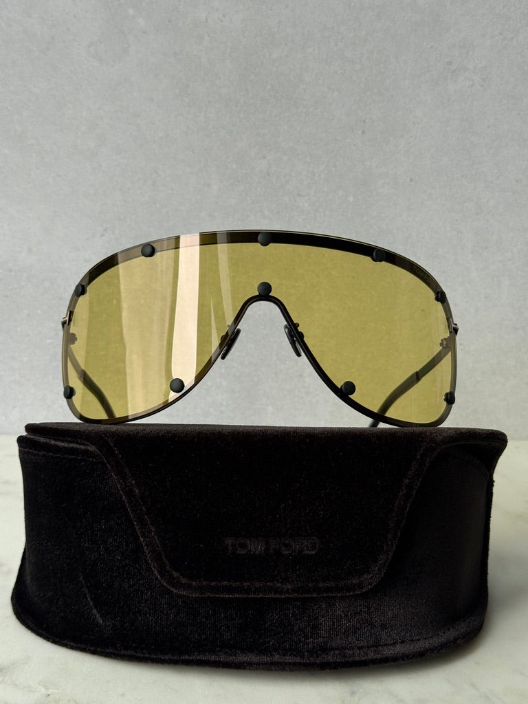 Front view yellow studded mask sunglasses with striped lenses on black pouch