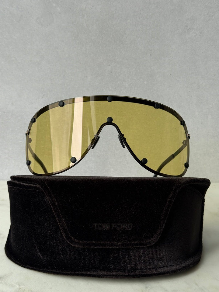 Front view yellow studded mask sunglasses with striped lenses on black pouch