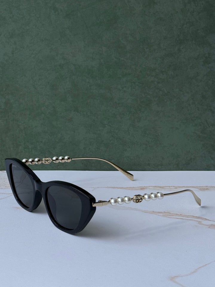 Gucci GG1257S Gafas de sol redondeadas con lentes marrones y rojos