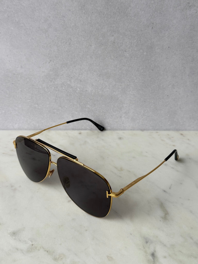 Gold aviator sunglasses with dark lenses, front-left angle