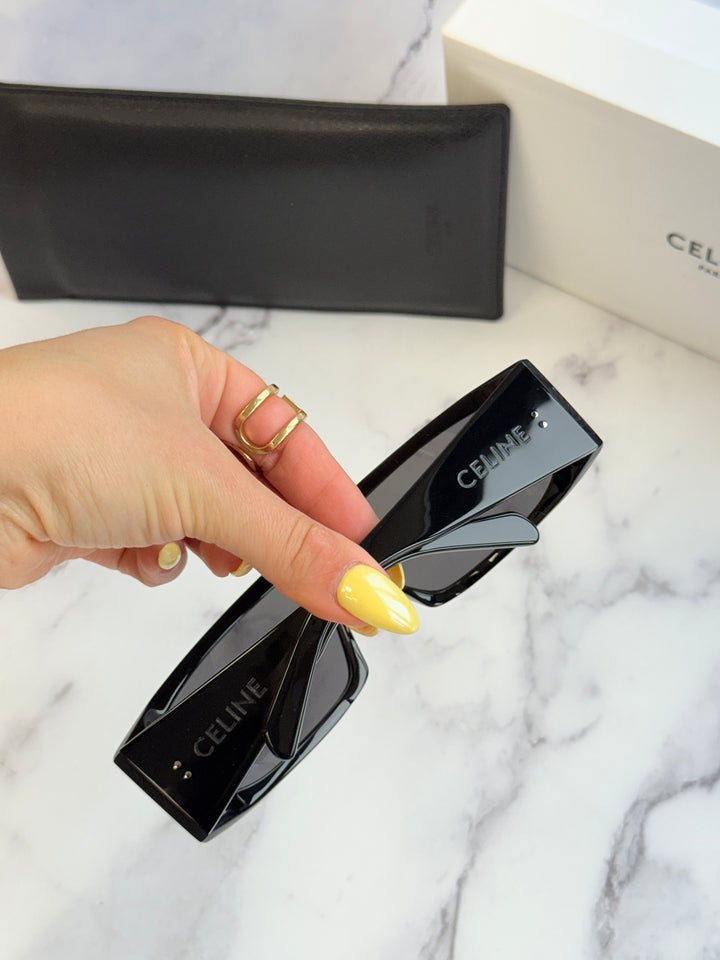 Celine black mask sunglasses with dark lenses and logo on the temple arm