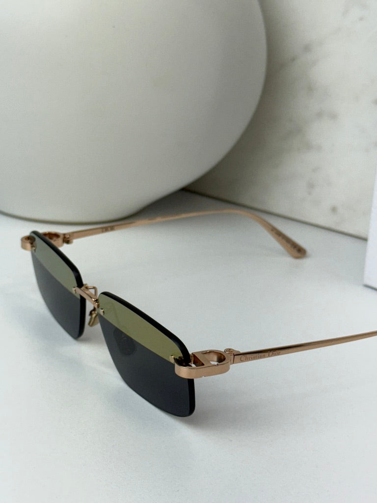 Rimless sunglasses with dark lenses and slim gold-tone temple arms