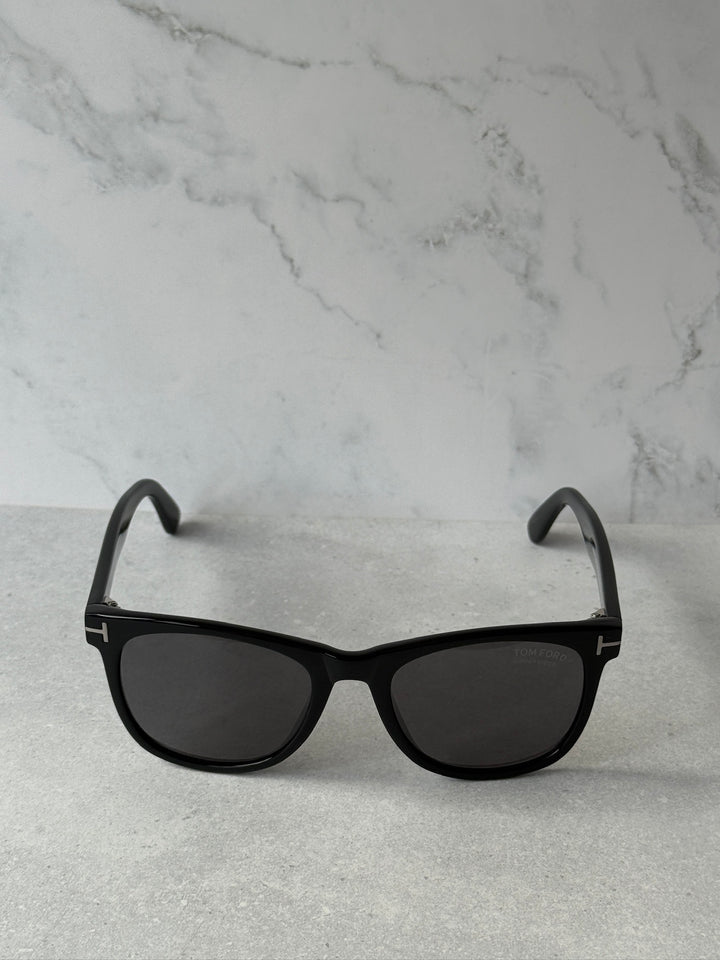 Black sunglasses with dark polarized lenses and curved temples