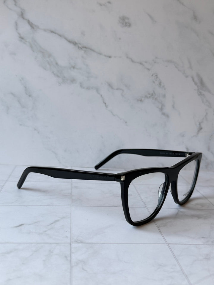 Black angular eyeglass frames with clear lenses and slim temple arms