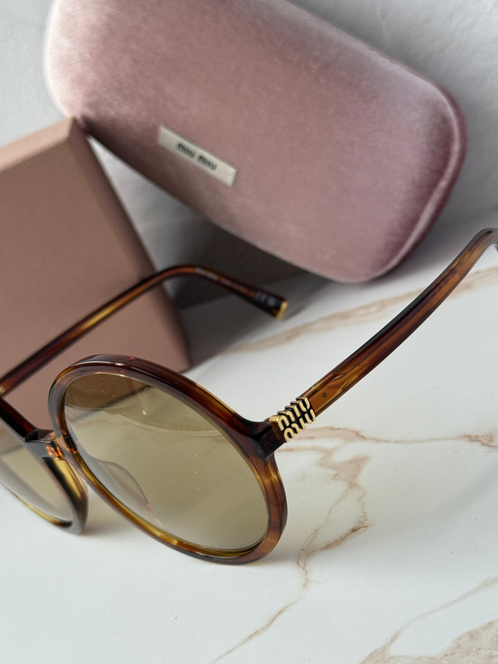 Miu Miu round sunglasses, brown tortoiseshell frame, gold-tone arm with logo