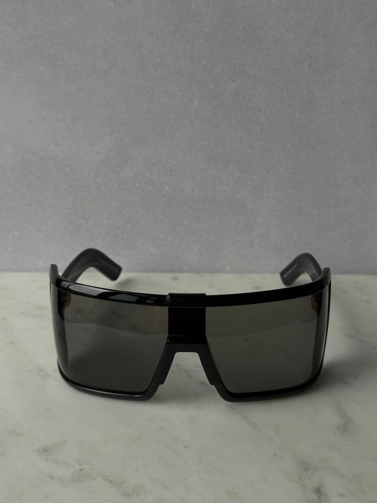 Black mask-style sunglasses with dark tinted rectangular lenses