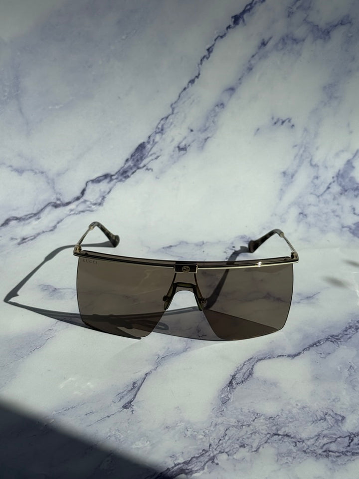 Gucci GG1096S Gafas de sol sin montura con protección marrón