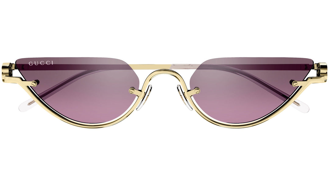 Gucci half-rim sunglasses with gold frame and pink tinted lenses