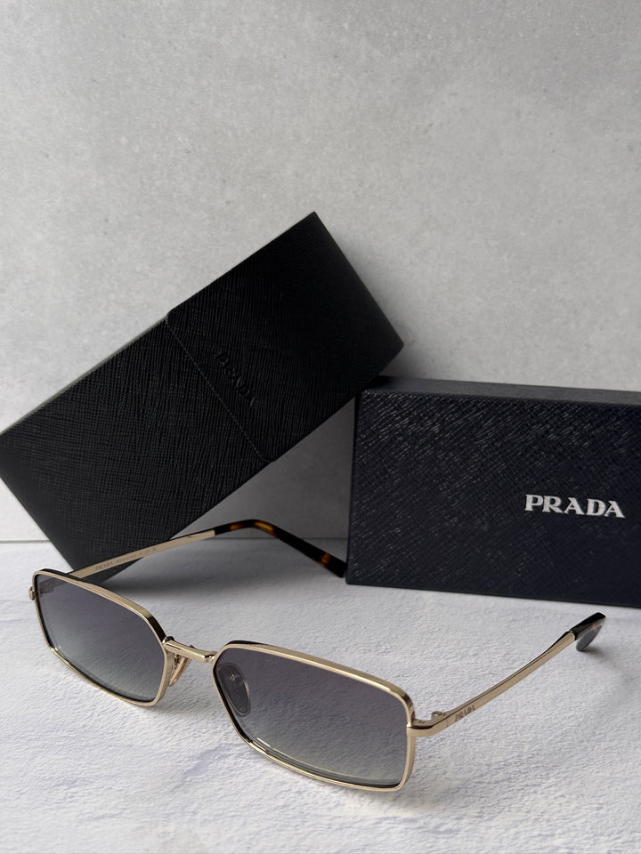 Gold metal rectangle sunglasses with gray tinted lenses and PRADA box and case