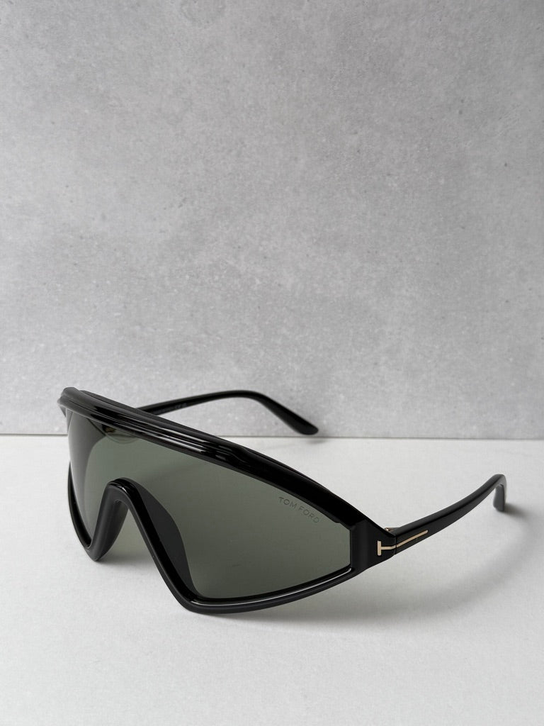 Black angular sunglasses with dark green lenses and slim arms
