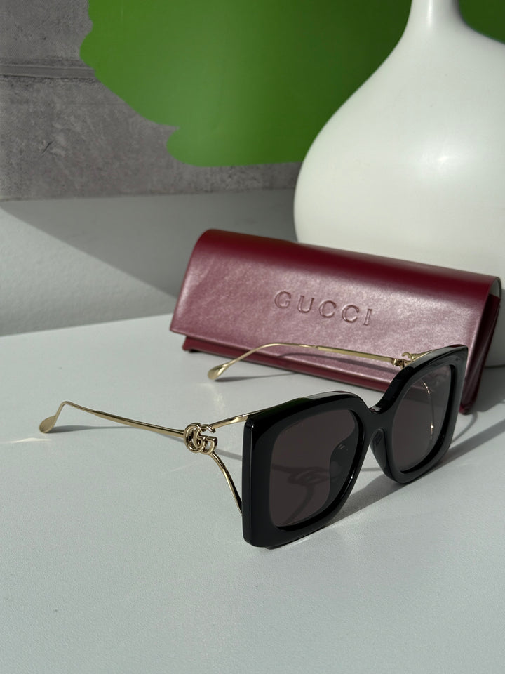 Gucci GG1257S Gafas de sol redondeadas con lentes marrones y rojos