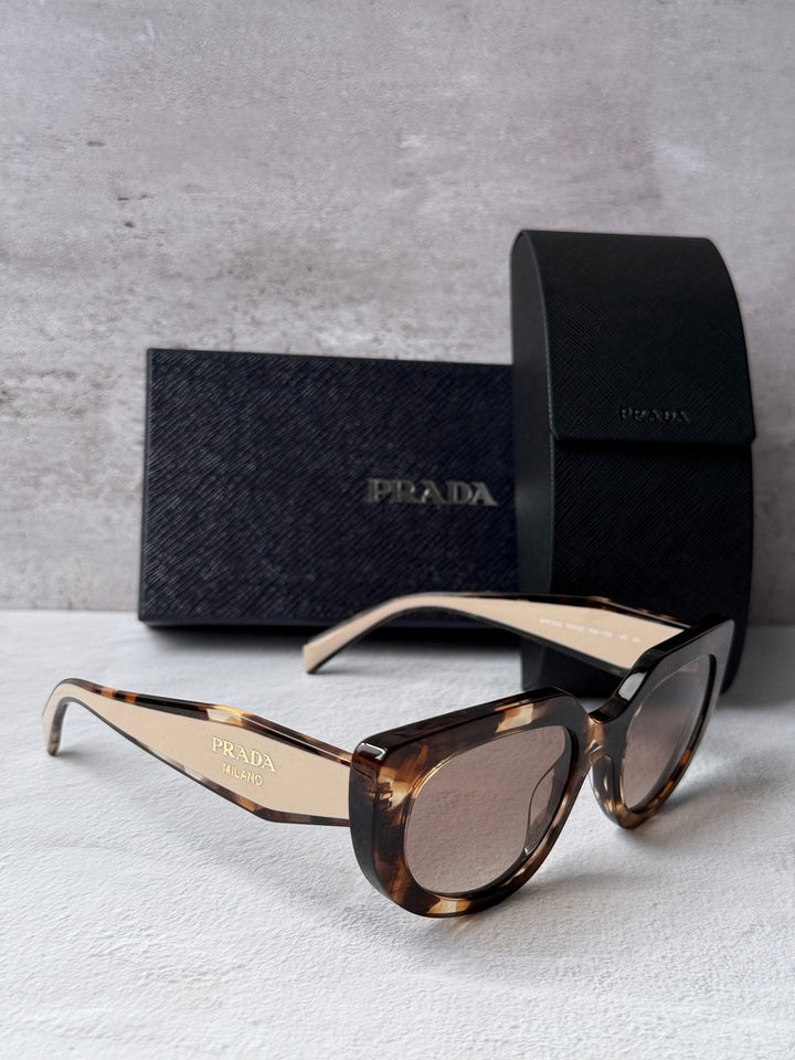 Prada cat-eye sunglasses with Havana powder frames and gold-toned temples