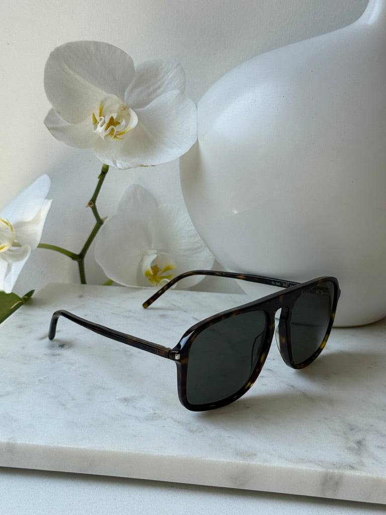 Aviator sunglasses with havana brown frame and dark lenses, side angle on display