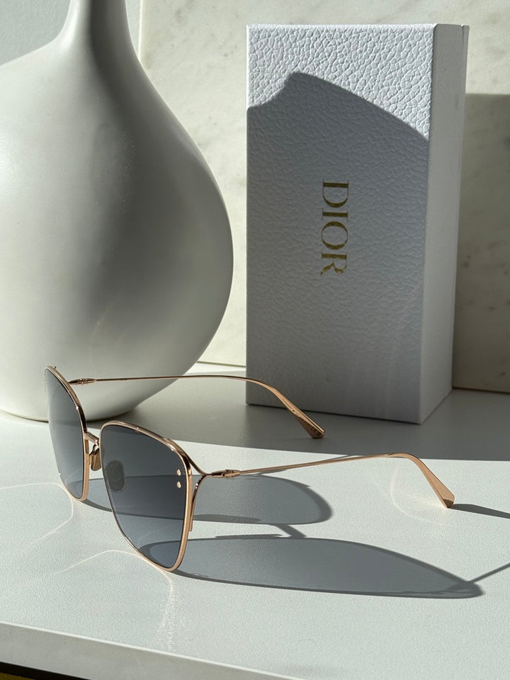 Dior gold-tone square sunglasses with dark grey gradient lenses, side profile