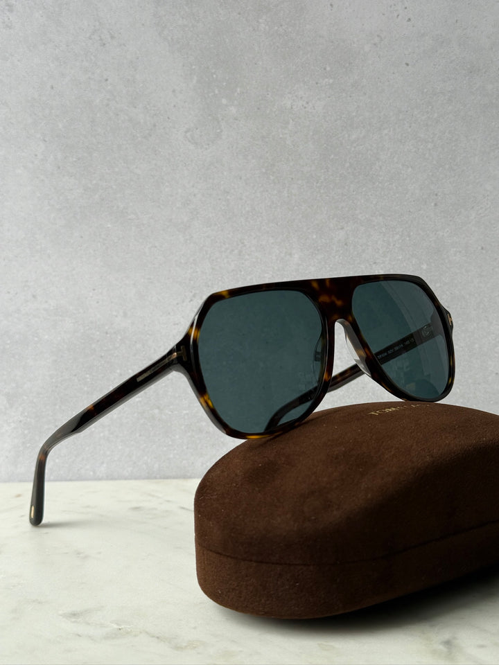 Aviator sunglasses, side view, dark Havana frame with green tinted lenses