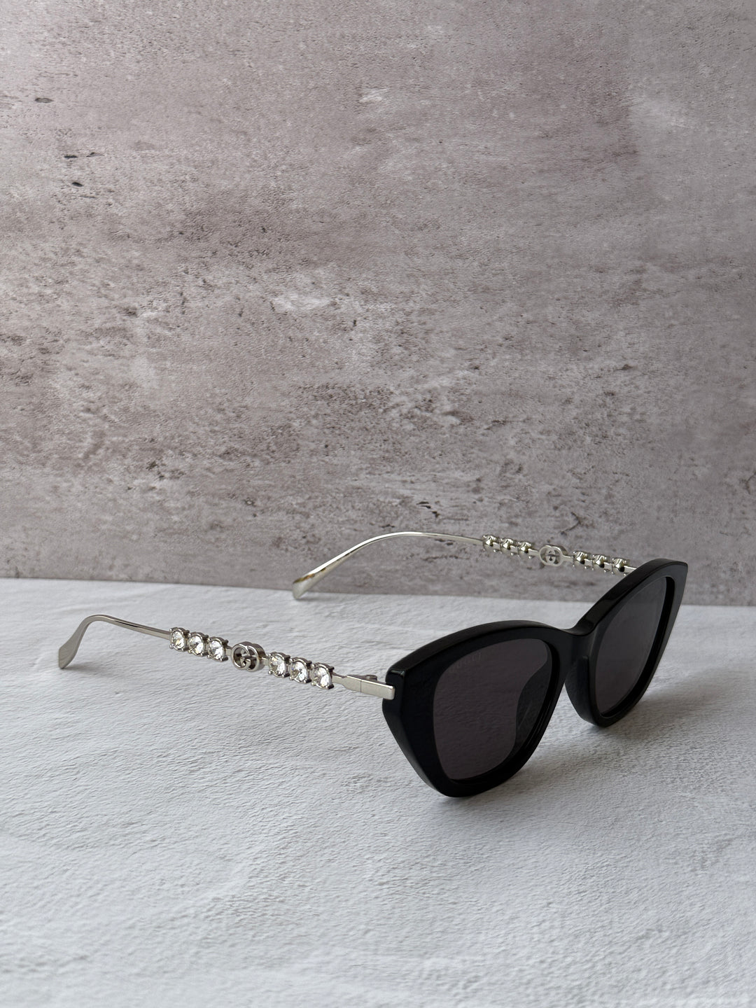Gucci cat-eye crystal sunglasses, black frame with dark lenses and rhinestone arms