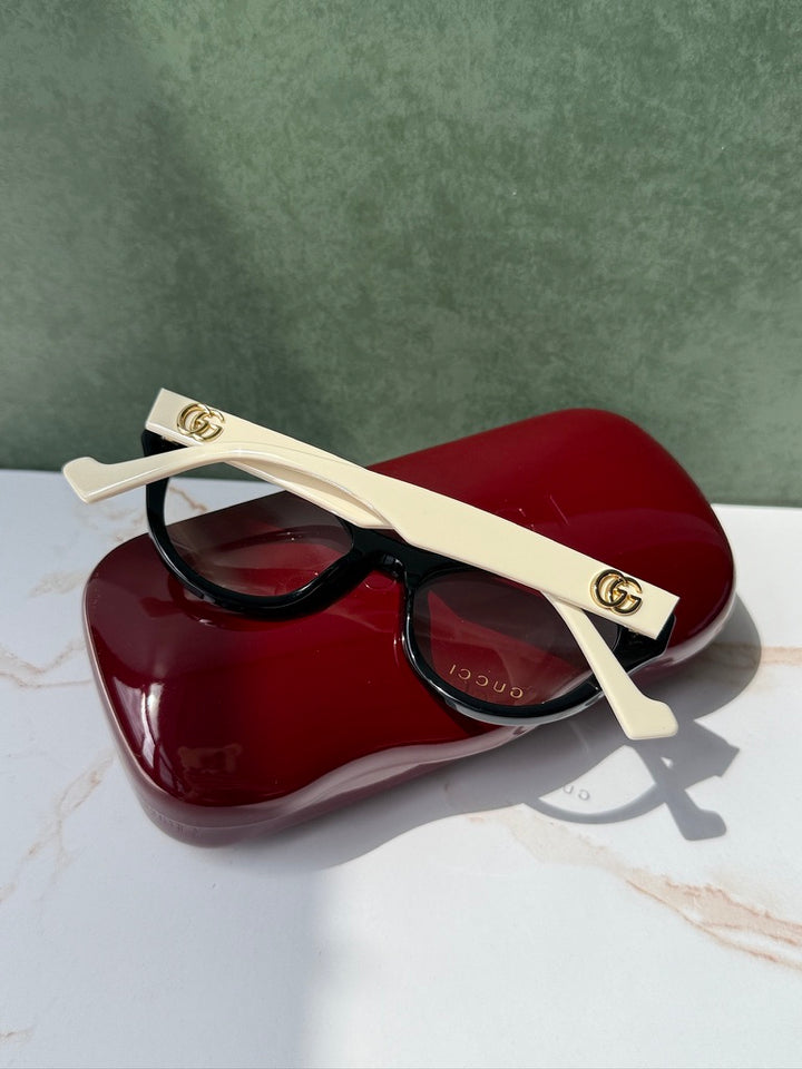 Monturas estilo ojo de gato Gucci GG0959O en negro marfil 