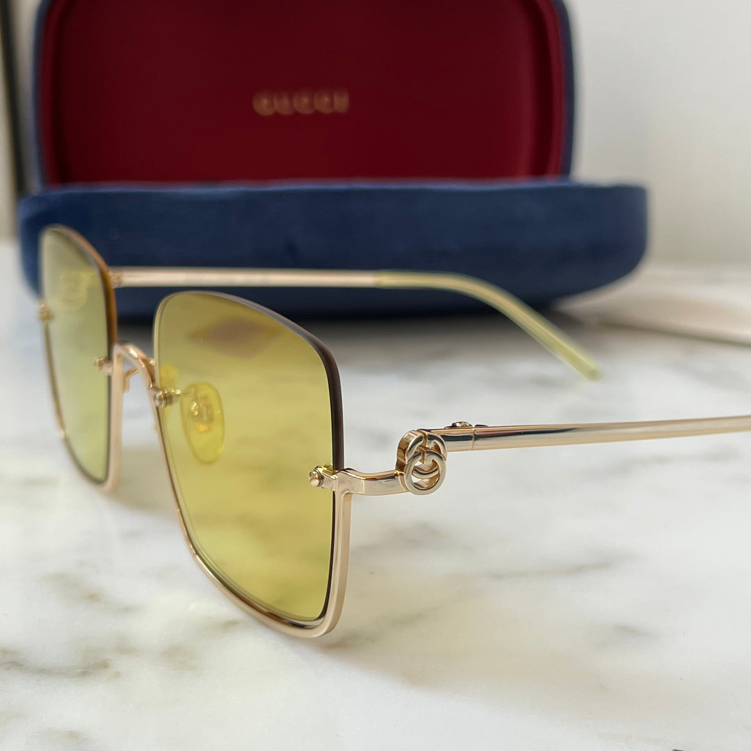 Gafas de sol cuadradas sin montura en dorado Gucci GG1279S
