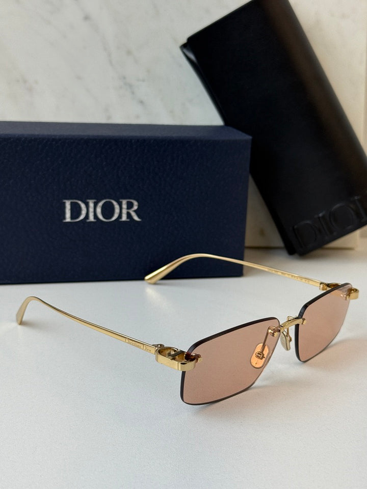 Dior rimless sunglasses side view, tinted pink lenses and gold-tone frame